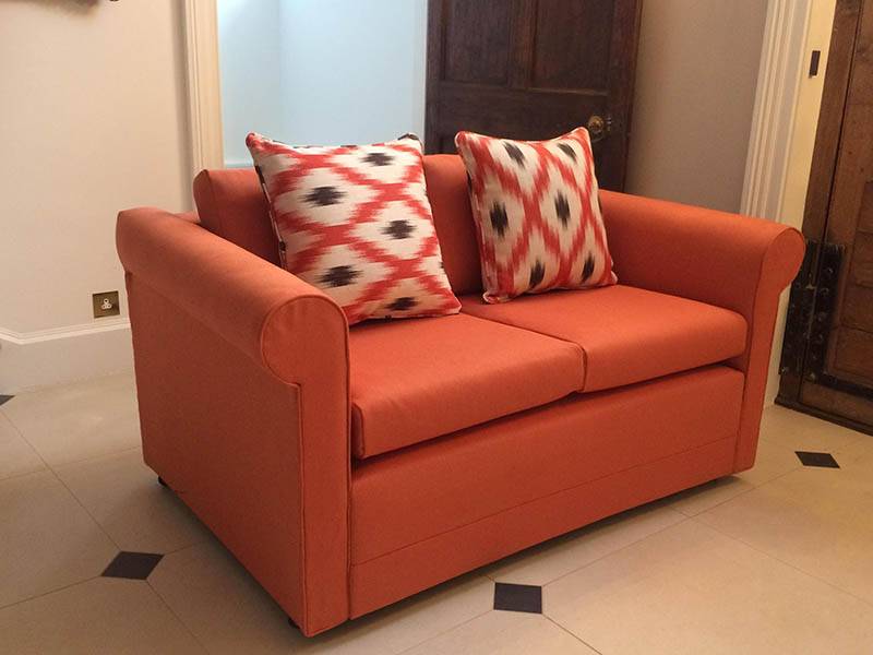 orange sofa in room